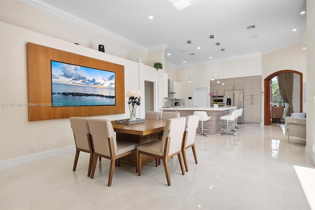 2541 Golf View Dr, Weston, FL 33327 - dining room featuring arched walkways, ornamental molding, recessed lighting, light tile patterned flooring, and baseboards
