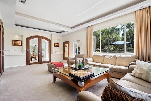 2541 Golf View Dr, Weston, FL 33327 - living area with french doors, arched walkways, a raised ceiling, carpet flooring, and baseboards