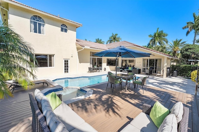 2541 Golf View Dr, Weston, FL 33327 - swimming pool featuring outdoor lounge area, a wooden deck, outdoor dining area, and a jacuzzi