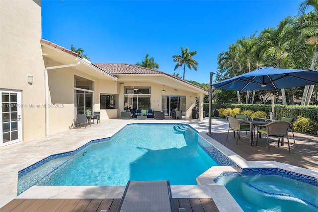 2541 Golf View Dr, Weston, FL 33327 - view of swimming pool featuring outdoor lounge area, ceiling fan, a patio, outdoor dining space, and a pool with connected hot tub