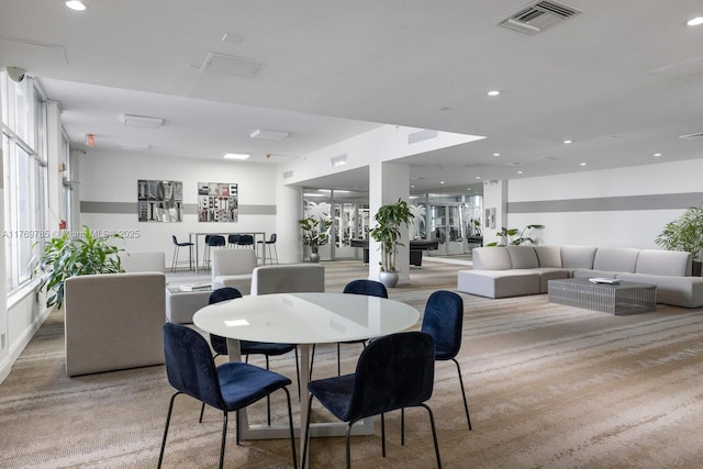 dining room featuring carpet floors, a wealth of natural light, visible vents, and recessed lighting