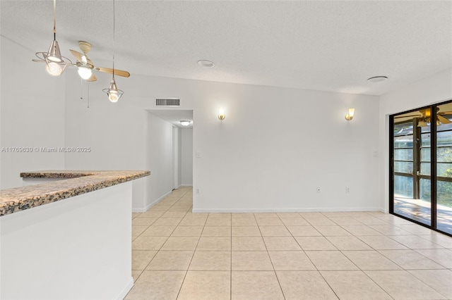 915 NE 199th St Unit 202-15, Miami, FL 33179 - unfurnished room featuring a textured ceiling, visible vents, and light tile patterned floors