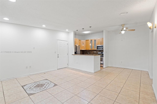 915 NE 199th St Unit 202-15, Miami, FL 33179 - unfurnished living room with light tile patterned flooring, a textured ceiling, baseboards, ceiling fan, and recessed lighting
