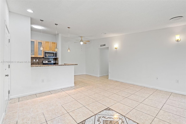 915 NE 199th St Unit 202-15, Miami, FL 33179 - unfurnished living room with light tile patterned flooring, baseboards, and ceiling fan