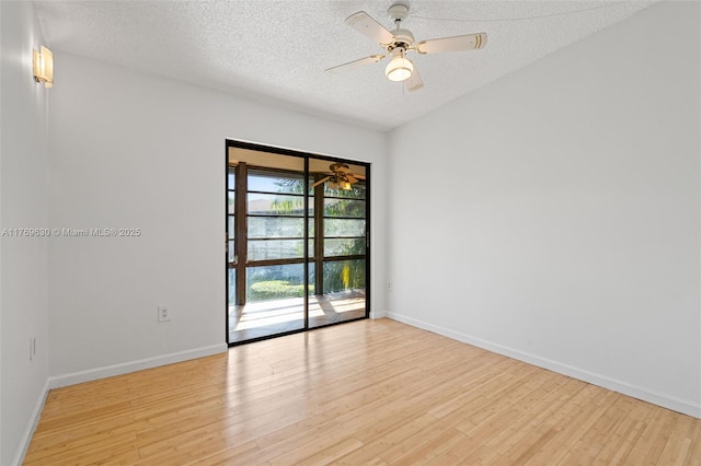 915 NE 199th St Unit 202-15, Miami, FL 33179 - empty room with baseboards, light wood-style floors, ceiling fan, and a textured ceiling