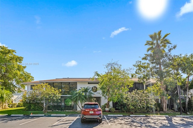 915 NE 199th St Unit 202-15, Miami, FL 33179 - view of front facade with uncovered parking