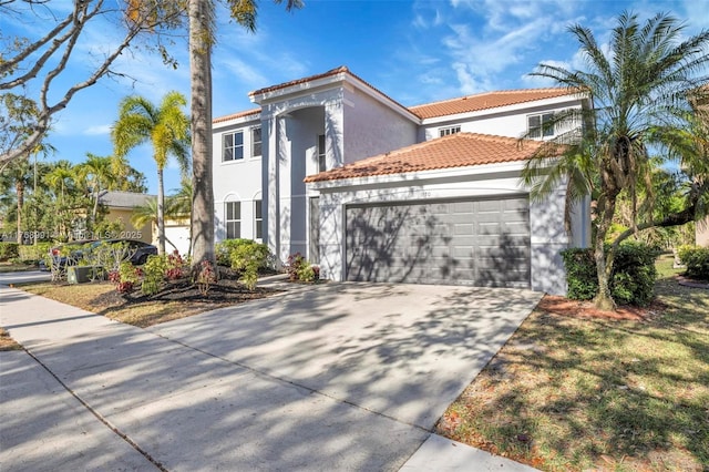1170 Chenille Cir, Weston, FL 33327 - mediterranean / spanish-style home featuring a tiled roof, stucco siding, an attached garage, and driveway