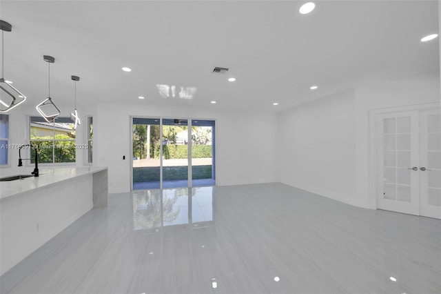 1170 Chenille Cir, Weston, FL 33327 - unfurnished living room with healthy amount of natural light, a sink, recessed lighting, and baseboards