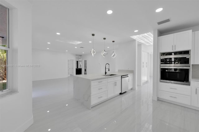 1170 Chenille Cir, Weston, FL 33327 - kitchen featuring appliances with stainless steel finishes, a sink, white cabinetry, recessed lighting, and hanging light fixtures