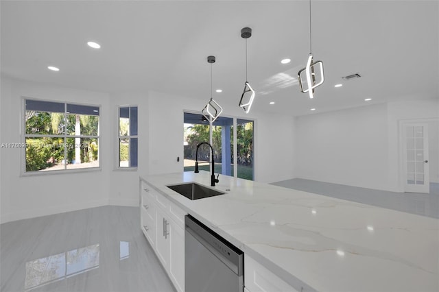 1170 Chenille Cir, Weston, FL 33327 - kitchen featuring stainless steel dishwasher, a sink, recessed lighting, light stone counters, and white cabinetry