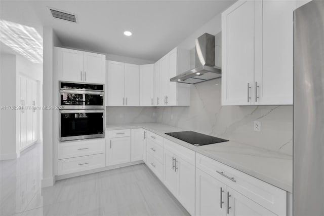 1170 Chenille Cir, Weston, FL 33327 - kitchen with wall chimney range hood, stainless steel appliances, light stone countertops, white cabinets, and recessed lighting