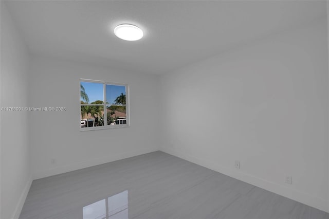1170 Chenille Cir, Weston, FL 33327 - spare room with wood finished floors and baseboards