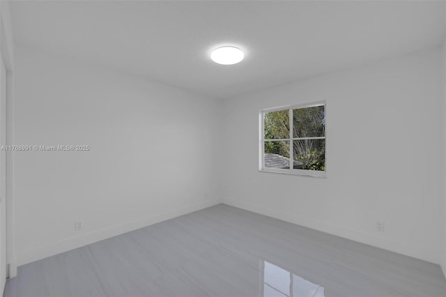 1170 Chenille Cir, Weston, FL 33327 - empty room with wood finished floors and baseboards