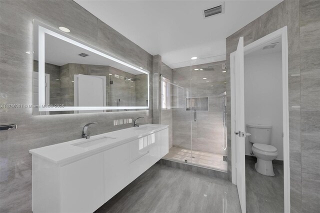 1170 Chenille Cir, Weston, FL 33327 - bathroom with tile walls, toilet, double vanity, a stall shower, and recessed lighting