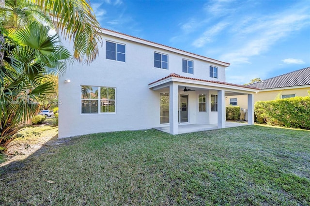 1170 Chenille Cir, Weston, FL 33327 - rear view of house with stucco siding, ceiling fan, a patio area, and a yard