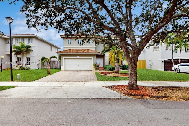 14214 SW 129th Path, Miami, FL 33186 - view of front of home with a tile roof, driveway, stucco siding, and an attached garage