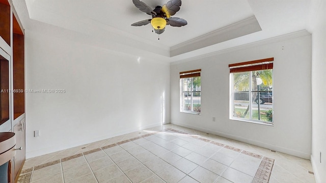 14214 SW 129th Path, Miami, FL 33186 - unfurnished room featuring light tile patterned floors, a raised ceiling, crown molding, inlaid floor details, and a ceiling fan