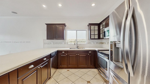 14214 SW 129th Path, Miami, FL 33186 - kitchen featuring appliances with stainless steel finishes, a sink, light countertops, light tile patterned floors, and recessed lighting