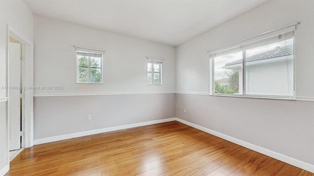 14214 SW 129th Path, Miami, FL 33186 - spare room with light wood-type flooring and baseboards