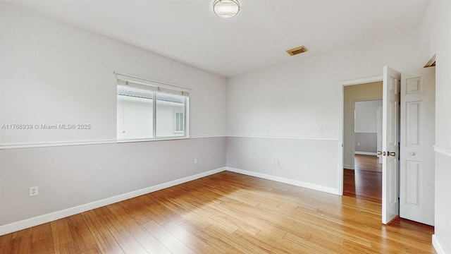 14214 SW 129th Path, Miami, FL 33186 - spare room featuring light wood finished floors and baseboards
