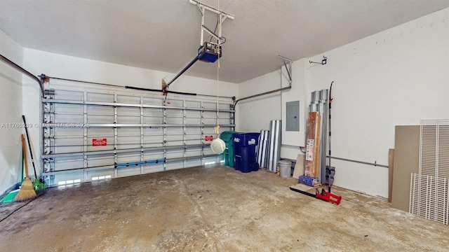 14214 SW 129th Path, Miami, FL 33186 - garage featuring electric panel and a garage door opener