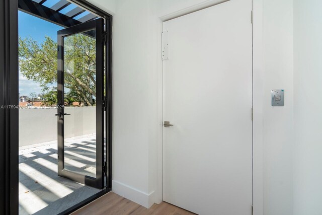 1635 E Broward Blvd, Fort Lauderdale, FL 33301 - entryway featuring light wood-type flooring and baseboards