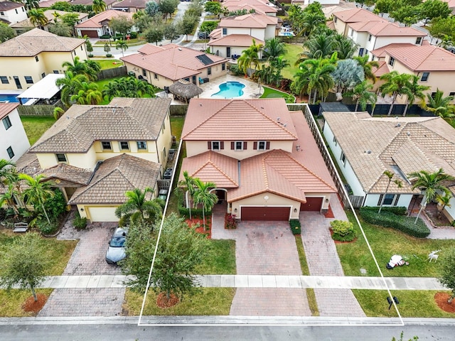 birds eye view of property with a residential view