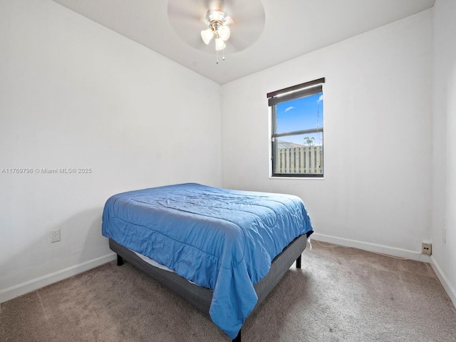 bedroom featuring baseboards, ceiling fan, and carpet floors