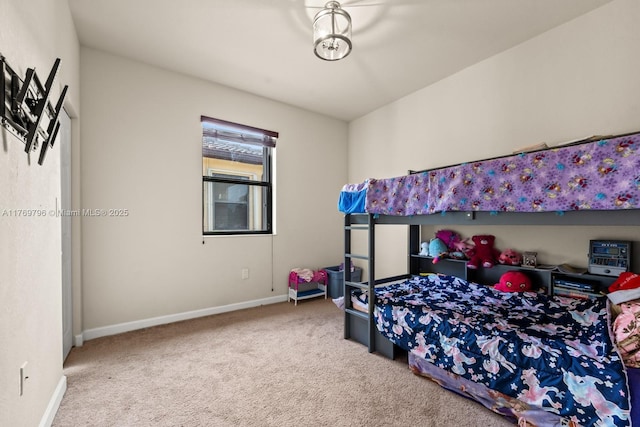bedroom with carpet and baseboards