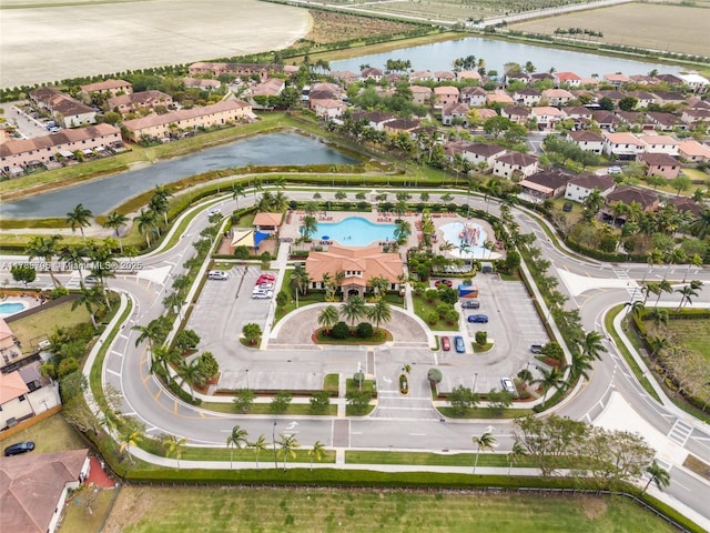 bird's eye view with a residential view and a water view