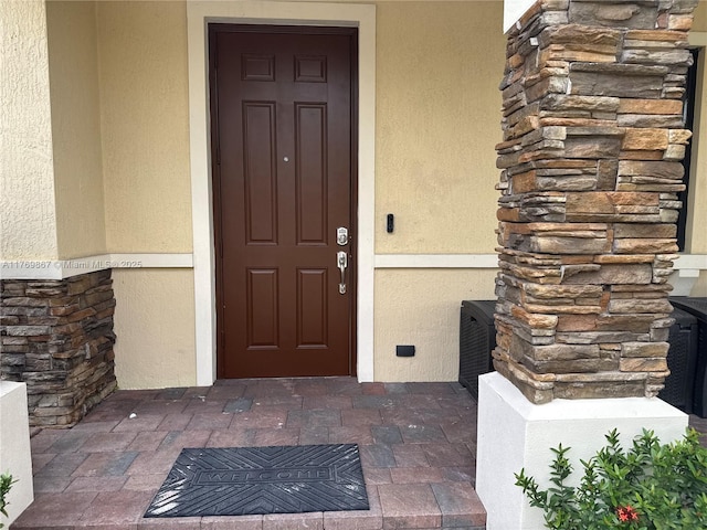 9840 NW 86th Ter, Doral, FL 33178 - property entrance with stucco siding and stone siding