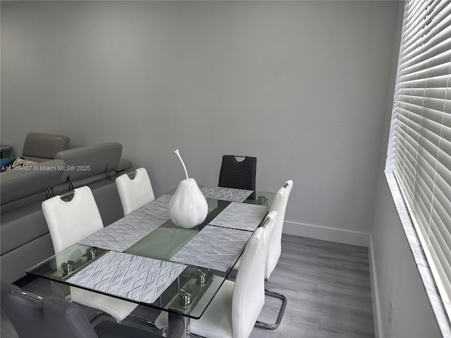 9840 NW 86th Ter, Doral, FL 33178 - dining room featuring baseboards and wood finished floors