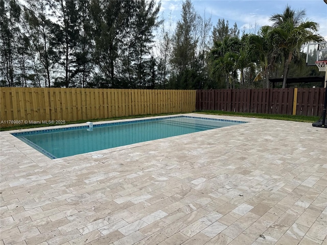 9840 NW 86th Ter, Doral, FL 33178 - view of pool featuring a fenced backyard, a patio area, and a fenced in pool