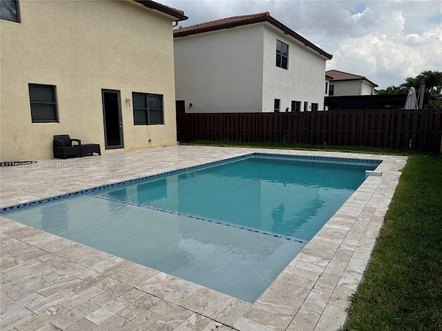 9840 NW 86th Ter, Doral, FL 33178 - view of swimming pool featuring a fenced backyard, a fenced in pool, and a patio area