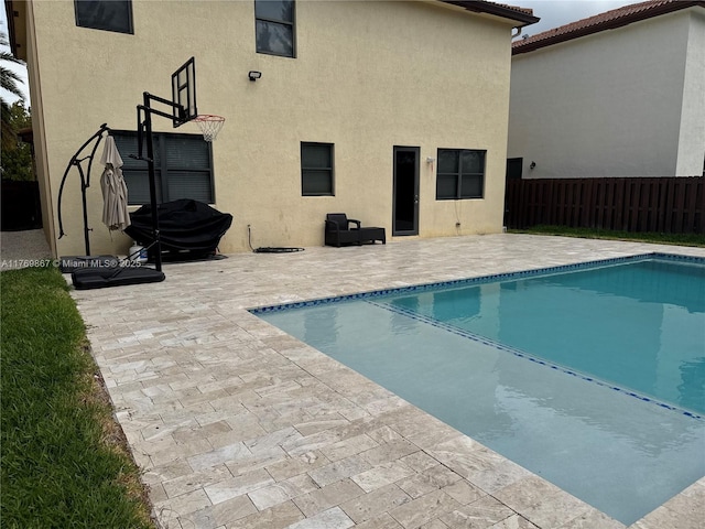 9840 NW 86th Ter, Doral, FL 33178 - view of swimming pool featuring a fenced in pool, fence, and a patio