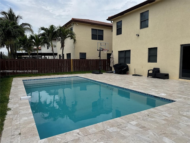 9840 NW 86th Ter, Doral, FL 33178 - view of pool featuring a fenced in pool, fence, and a patio