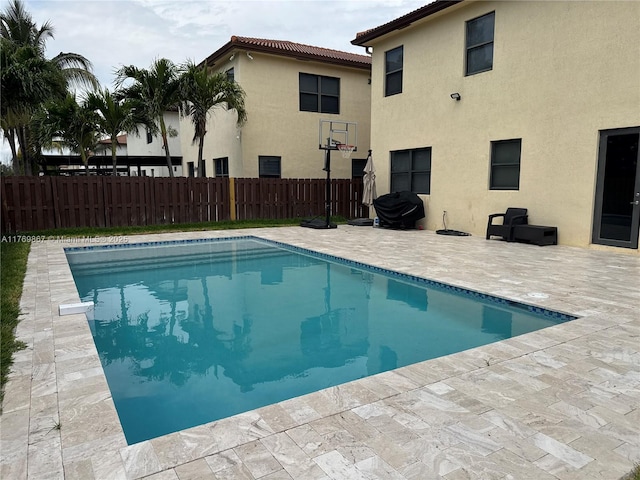9840 NW 86th Ter, Doral, FL 33178 - view of swimming pool featuring a patio area, fence, and a fenced in pool