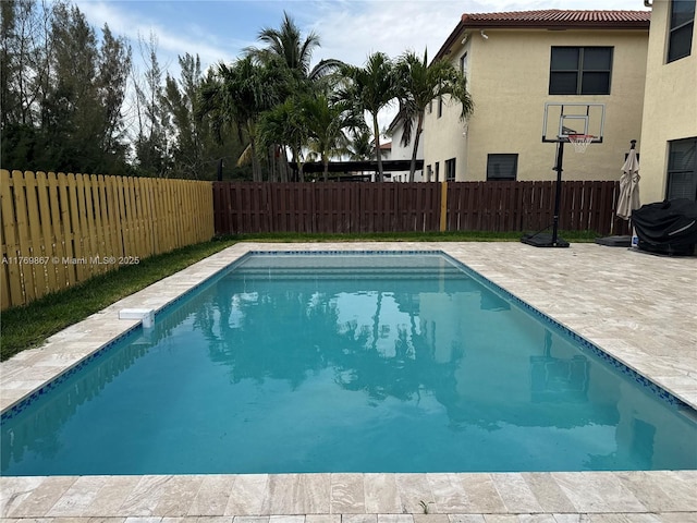 9840 NW 86th Ter, Doral, FL 33178 - view of swimming pool with a fenced backyard, a patio, and a fenced in pool