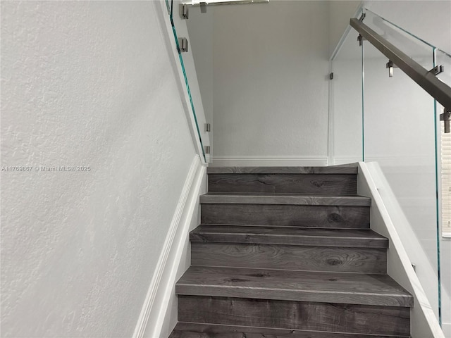 9840 NW 86th Ter, Doral, FL 33178 - staircase featuring a textured wall