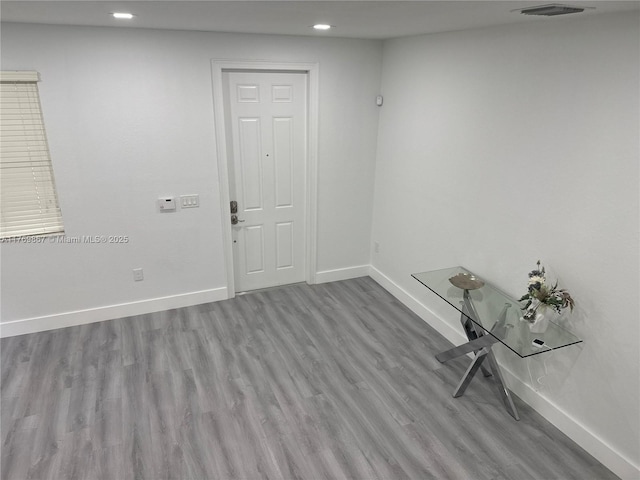 9840 NW 86th Ter, Doral, FL 33178 - unfurnished room with baseboards, visible vents, wood finished floors, and recessed lighting
