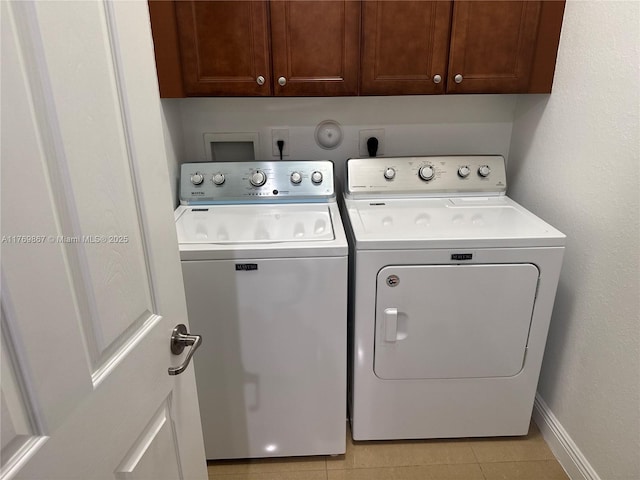9840 NW 86th Ter, Doral, FL 33178 - washroom featuring baseboards, cabinet space, washer and dryer, and light tile patterned floors