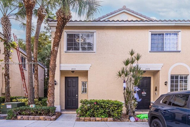 4834 NW 58th Mnr, Coconut Creek, FL 33073 - view of property featuring stucco siding