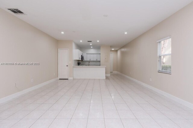 4834 NW 58th Mnr, Coconut Creek, FL 33073 - unfurnished living room featuring recessed lighting, baseboards, and visible vents