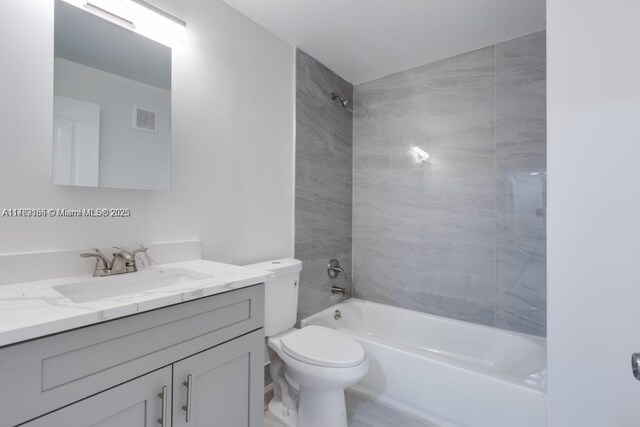 4834 NW 58th Mnr, Coconut Creek, FL 33073 - full bathroom with shower / bathing tub combination, visible vents, toilet, and vanity