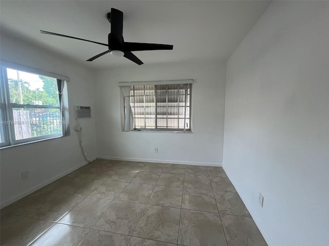 1167 NE 111th St, Miami, FL 33161 - empty room with baseboards, a wall mounted air conditioner, tile patterned flooring, and a ceiling fan