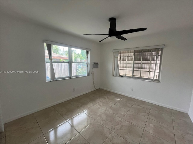 1167 NE 111th St, Miami, FL 33161 - tiled spare room with baseboards and ceiling fan