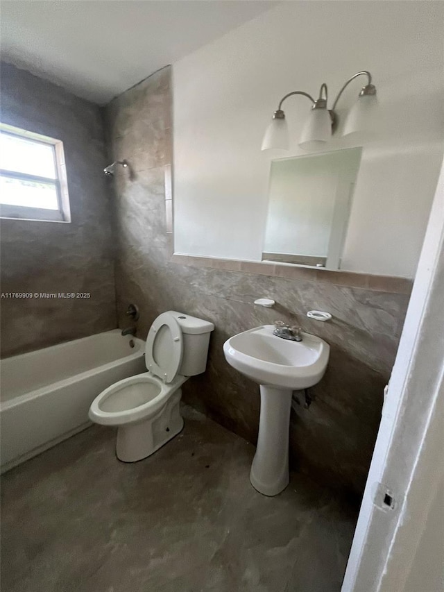 1167 NE 111th St, Miami, FL 33161 - bathroom with a wainscoted wall, shower / washtub combination, toilet, and tile walls