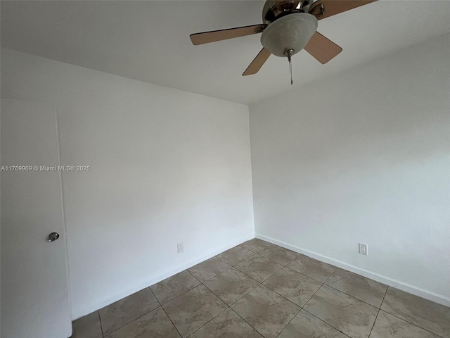 1167 NE 111th St, Miami, FL 33161 - spare room with baseboards and ceiling fan