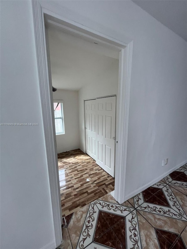 1167 NE 111th St, Miami, FL 33161 - hallway featuring baseboards and tile patterned flooring