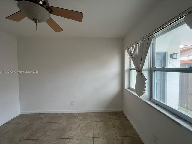 1167 NE 111th St, Miami, FL 33161 - empty room featuring baseboards, light tile patterned flooring, and a ceiling fan